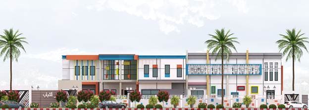 Front elevation of the youth center with palms and colorful facade accents