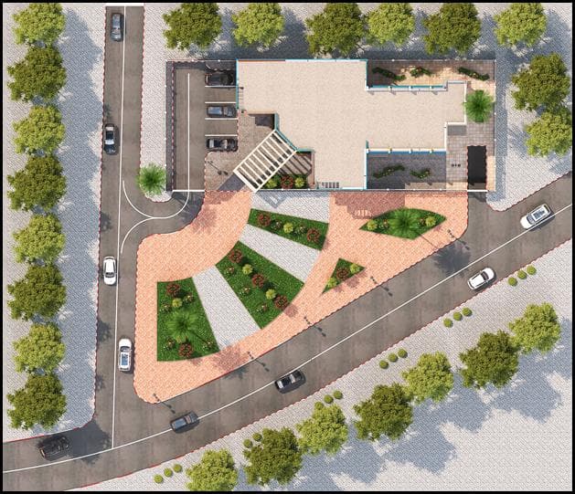 Top-down site plan showing the youth center, landscaped plaza, roads, and parking